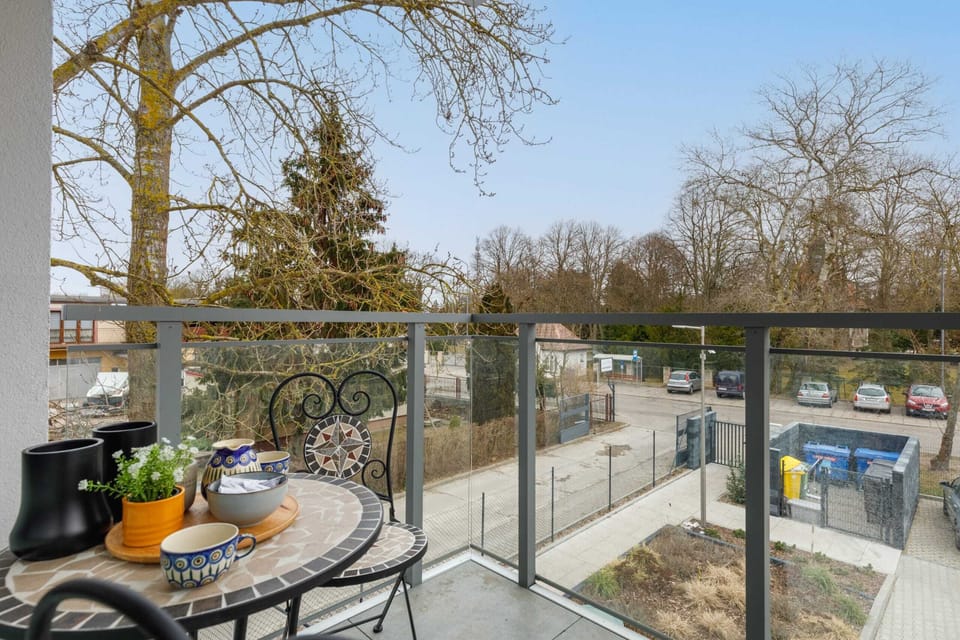 The balcony's stylish design complements the apartment's decor. 