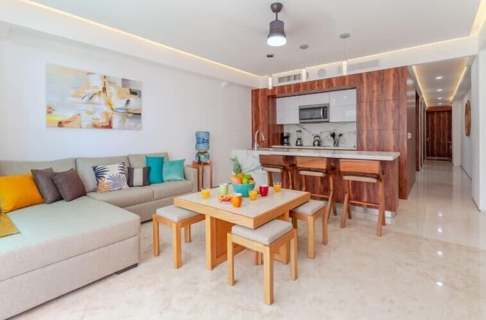 Full view of living dining space with entry hall