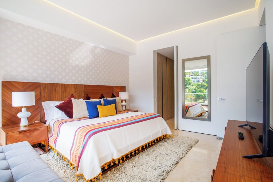 The bright bedroom also has black-out curtains for a better sleep
