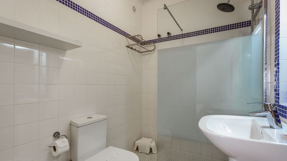 Refresh in this pristine bathroom featuring a modern walk-in shower and clean, minimalist design for your comfort.
#Bathroom #WalkInShower #LovelyStay
