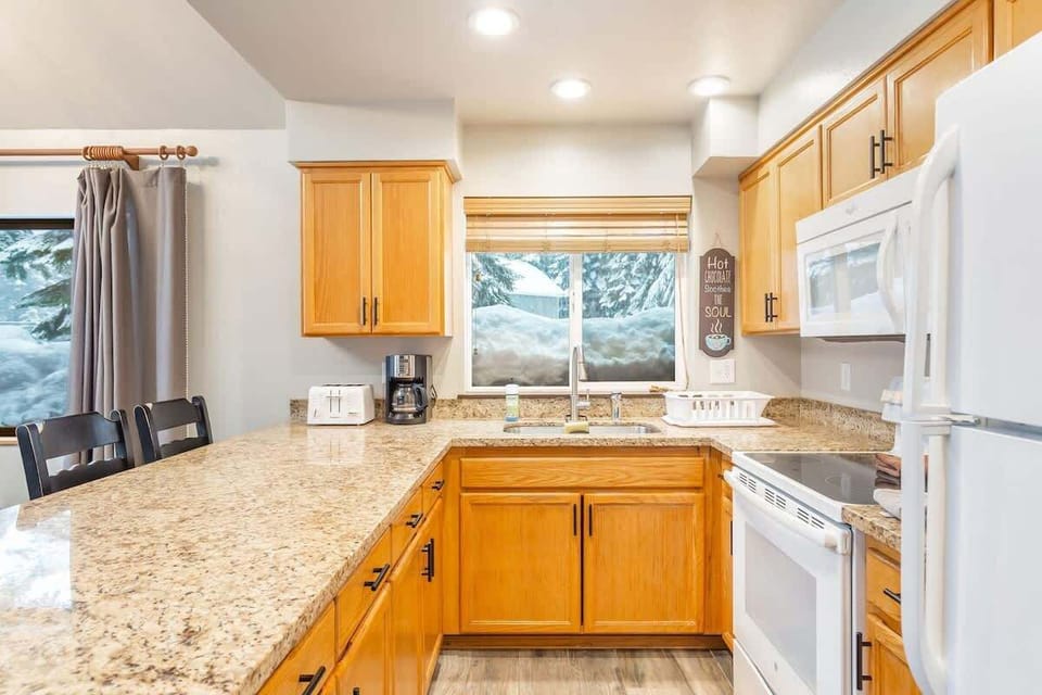 Full kitchen setup with everything you need to cook a meal or brew coffee.