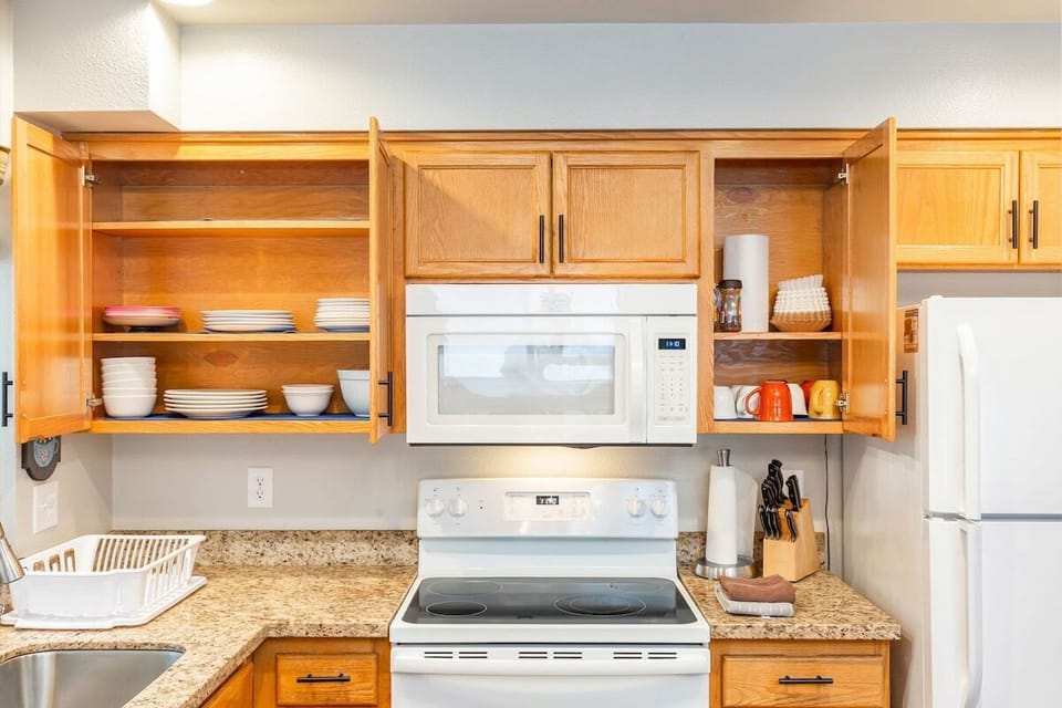 Clean, functional kitchen with major appliances and lots of prep space.