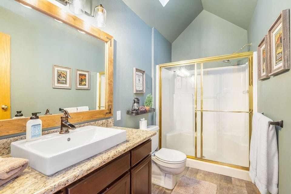 Second full bath with tub and natural light. Shared between upper bedrooms.