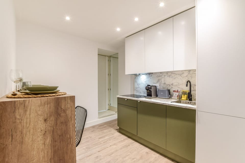 Main view of the kitchen and dining space with high table and stools