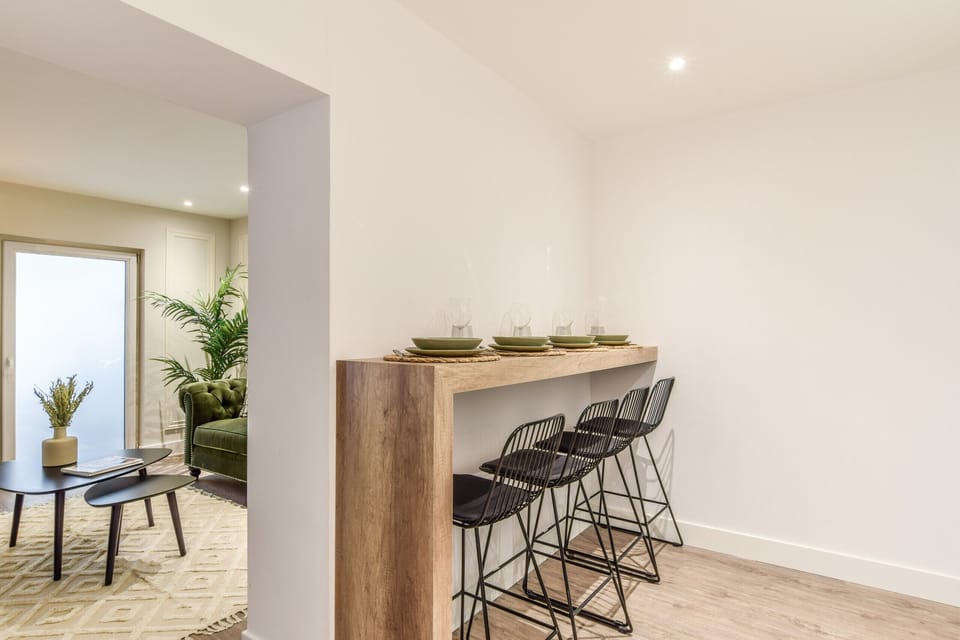 View from the kitchen and dining area with high table and stools