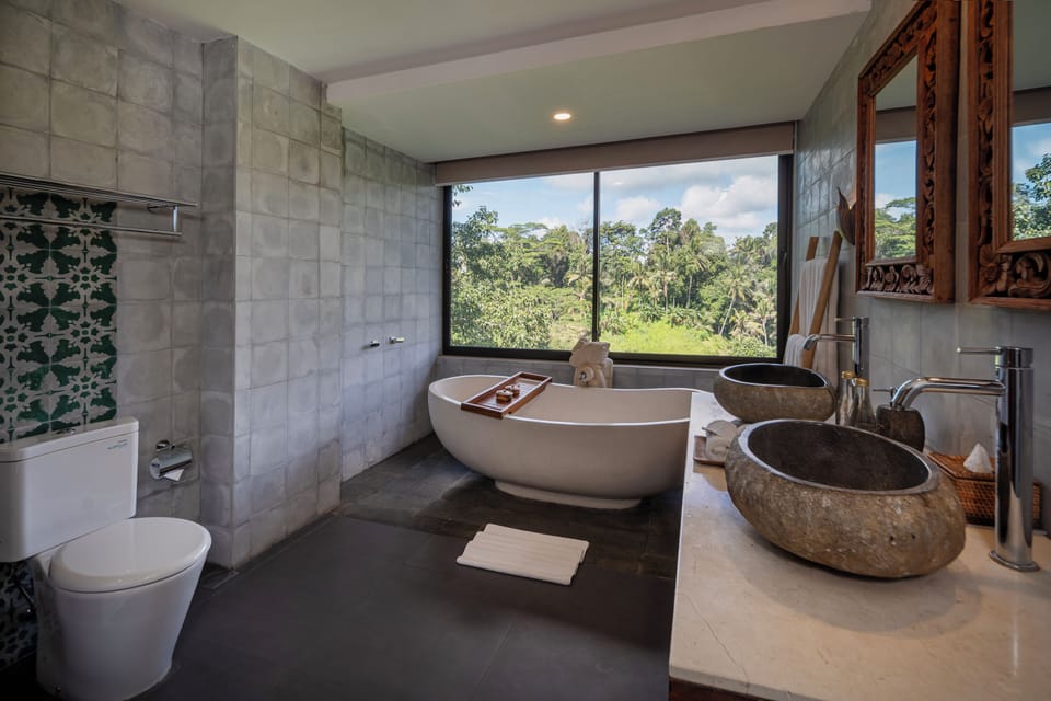 Separate tub and shower, rainfall showerhead, designer toiletries