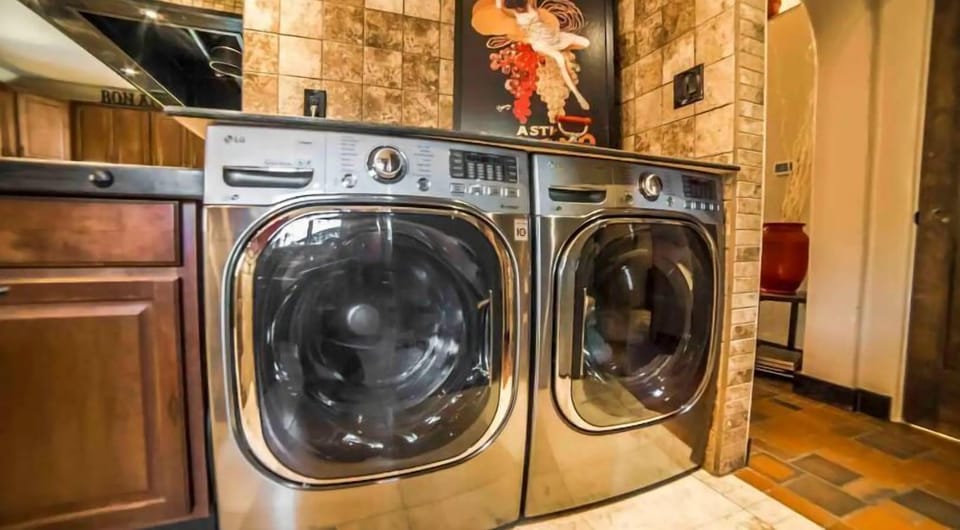 Full-size washer & dryer are conveniently located on the main floor in the Prep Kitchen area. 