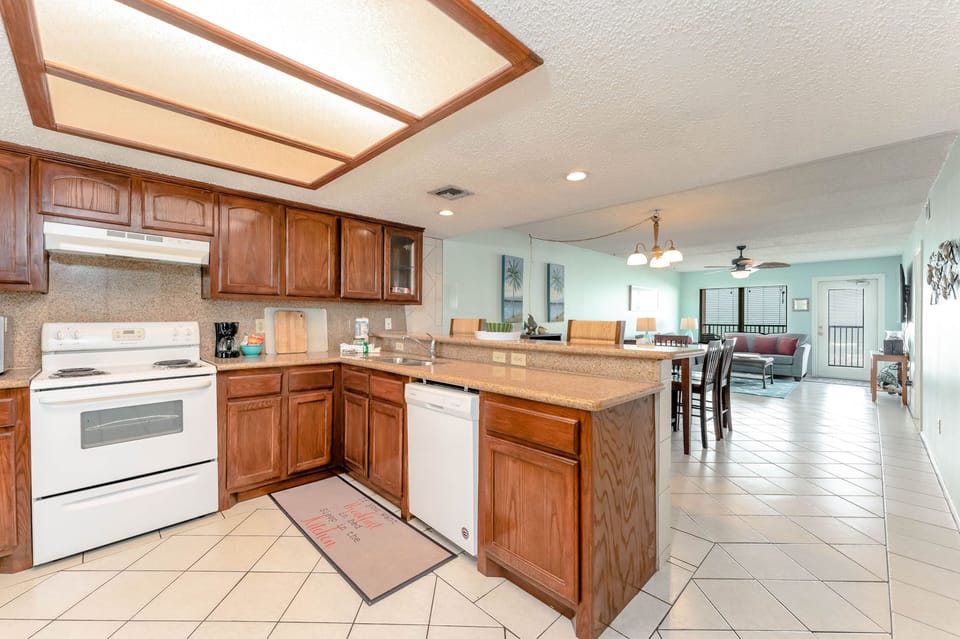 The light and laughter flow through our open-concept beachfront condo. You're going to feel right at home.