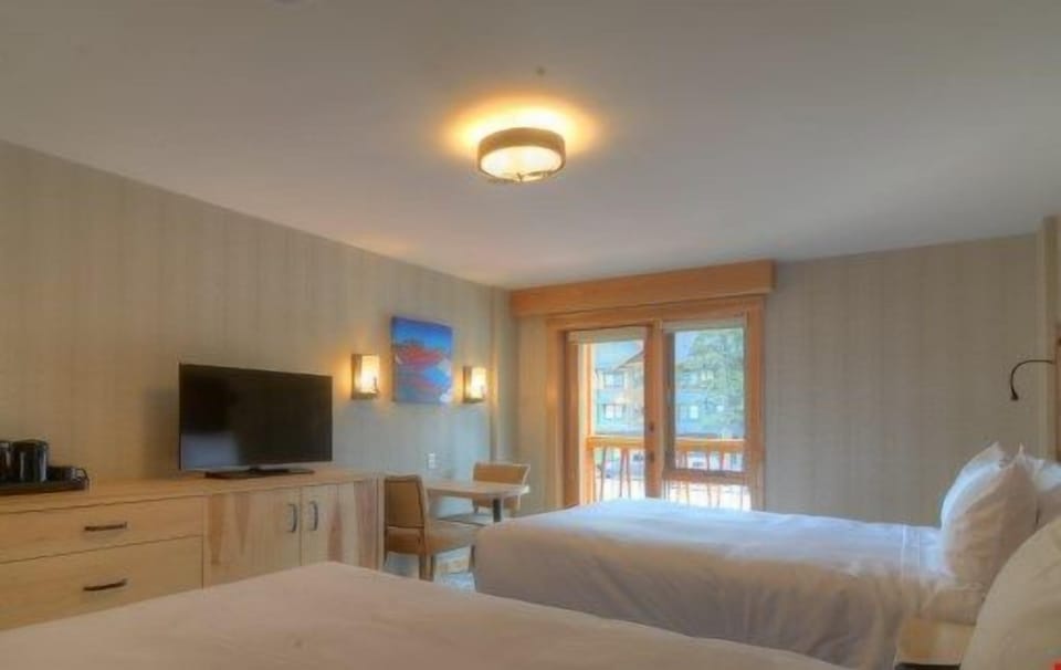 Relax on the two luxurious queen-sized beds after a day outside.
