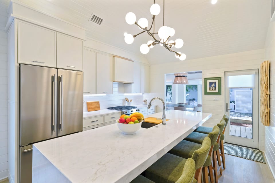 RENOVATED KITCHEN W/CENTRAL ISLAND; SEATS FIVE