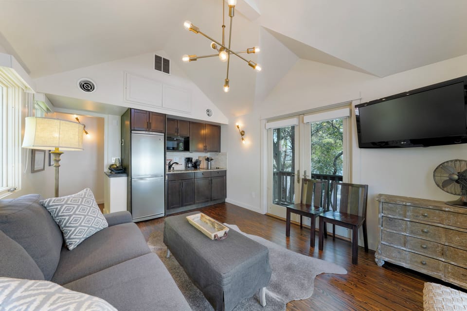 OPEN LIVING WITH BALCONIES UP, NEXT TO EFFICIENCY KITCHEN AREA