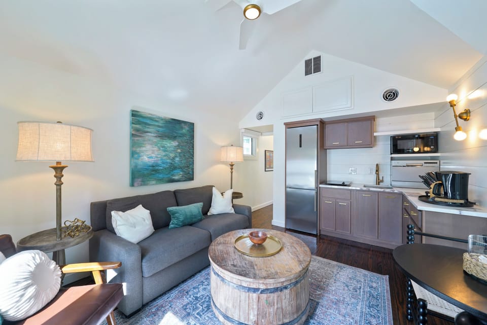 LIVING AREA WITH TEMPURPEDIC QUEEN SLEEPER SOFA FOR TWO MORE