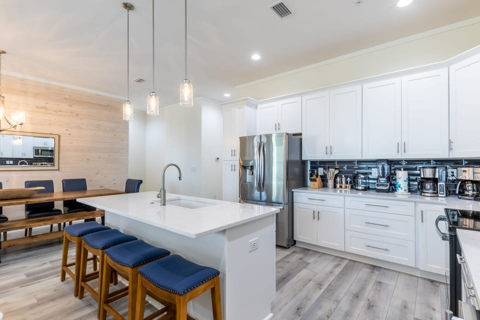 Welcome to a kitchen fit for a top chef! Prepare to be amazed by the abundance of cooking tools, gadgets, and appliances at your disposal in this fully stocked culinary hub.