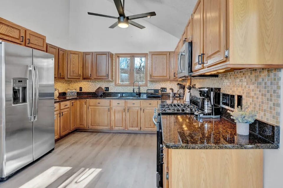 Fully equipped kitchen with stainless steel appliances.