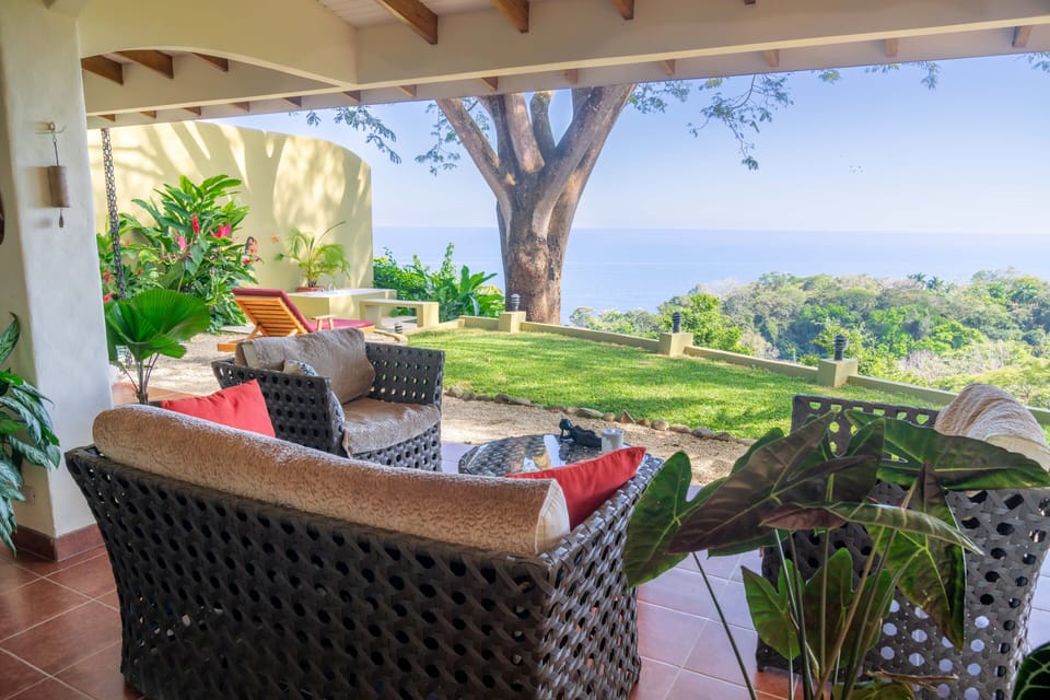 View from the living room. To the left: the private bathtub with tropical shower