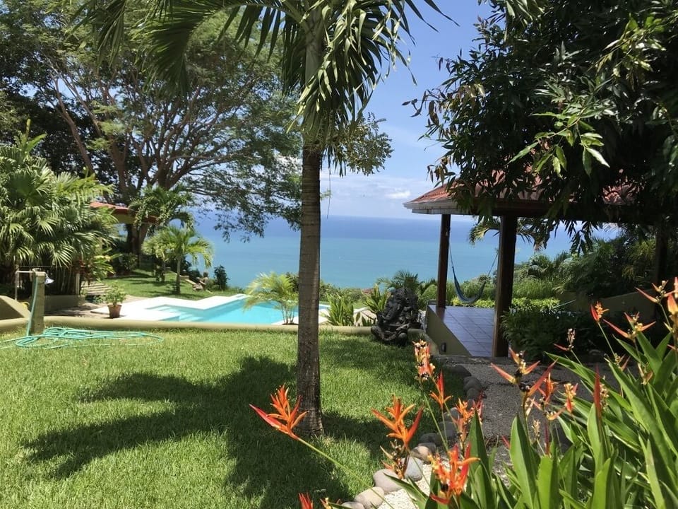 The Yoga pavilion on the right, the pool and the house to the left.