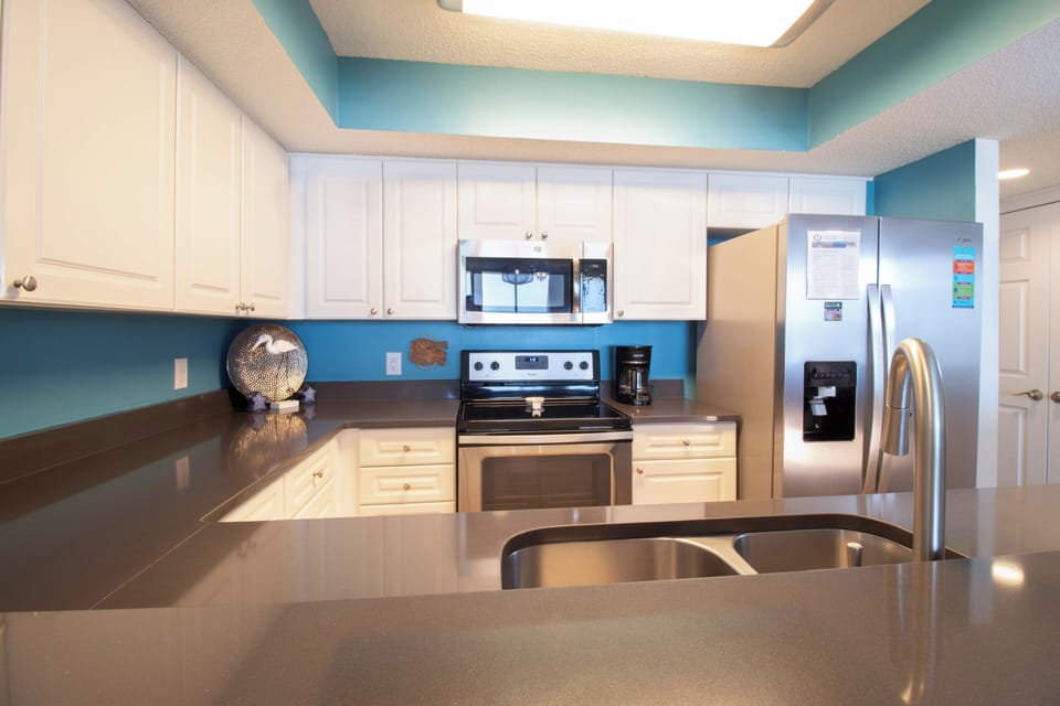 Your fully equipped kitchen features sleek appliances and ample counter space, perfect for preparing memorable meals during your stay.