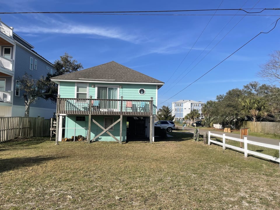 View of front of the house.  Driveway is on the side with parking for three cars