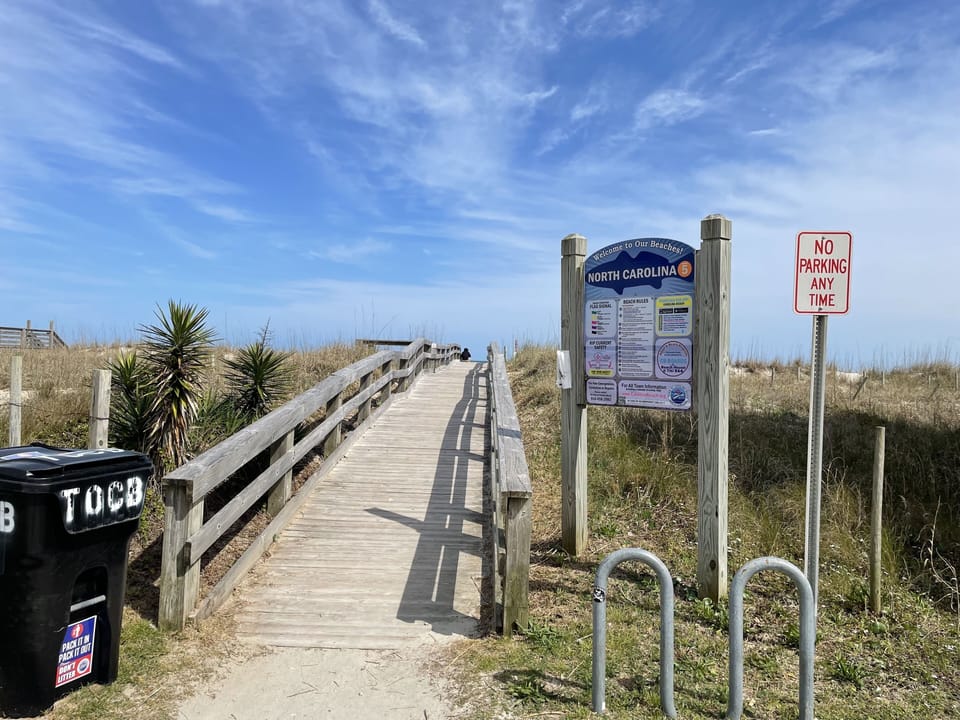 Entrance to the beach - three short block wall across protected cross walk
