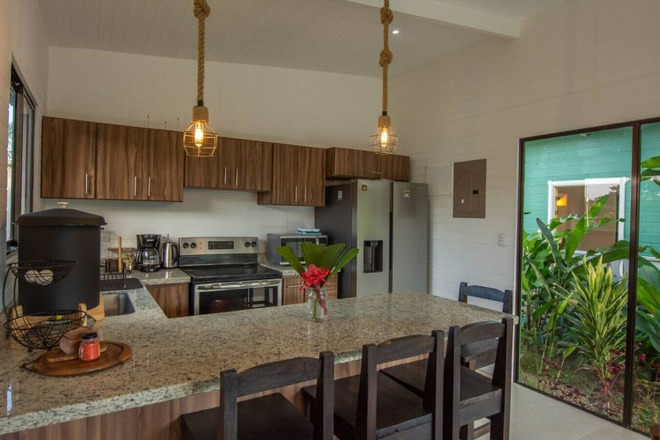 Fully equipped kitchen with breakfast bar and drinking water filter in Cahuita