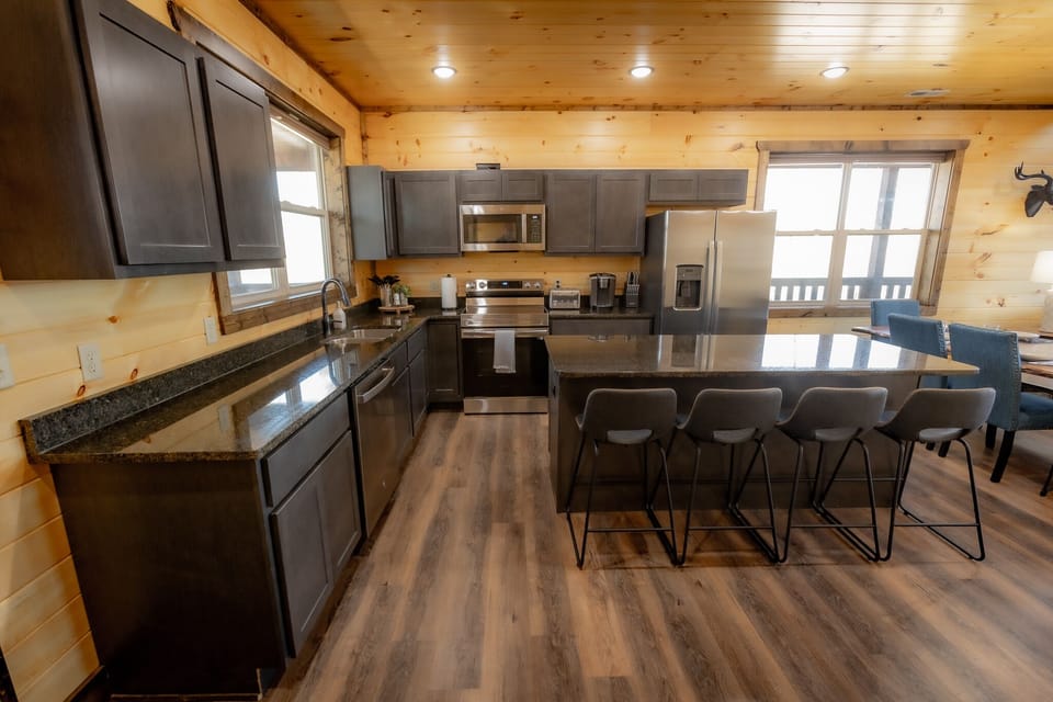 Wonderful, large island in the kitchen provides additional space for dining.