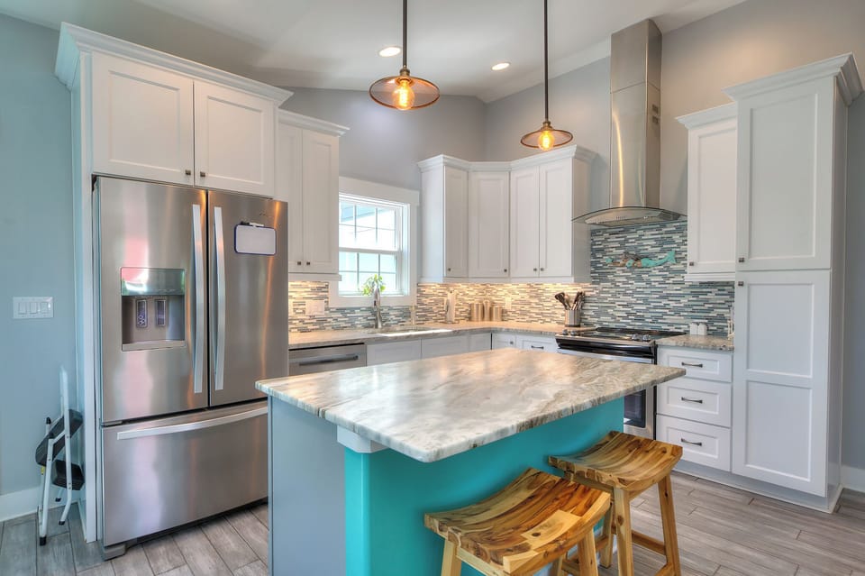 Fully equipped gourmet kitchen with stainless appliances, granite countertops