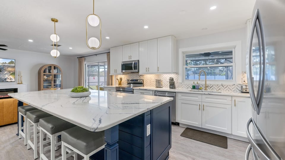 Functional kitchen stocked with key appliances—stove, oven, microwave, dishwasher, and all the essentials.