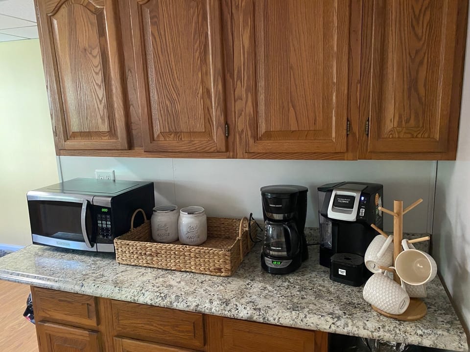 Keurig or drip coffee maker with coffee and creamer included during your stay.