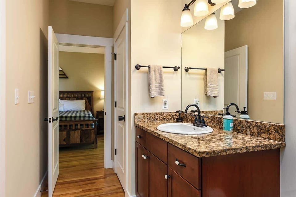 The spacious master bathroom. All your bath linens are provided, including makeup removing towels. The closet shown is locked and where we keep supplies. A large walk-in closet is adjacent to this bathroom and provides plenty of storage space.