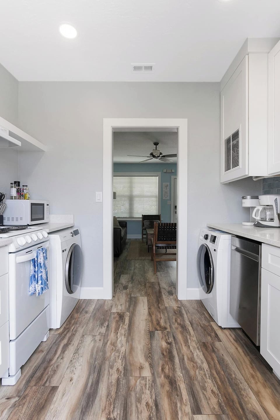 Fully equipped kitchen with apartment-size appliances.  Kitchen sink, dishwasher, coffee maker, Keurig coffee maker, dishwasher, clothes washer, dryer, 4 burner range/oven, and refrigerator.  The back door to the kitchen leads out to your private fen