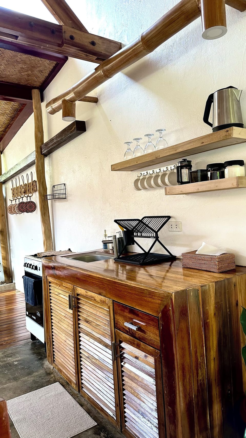 Villa | Private kitchen | Fridge, electric kettle, cookware/dishes/utensils, dining table