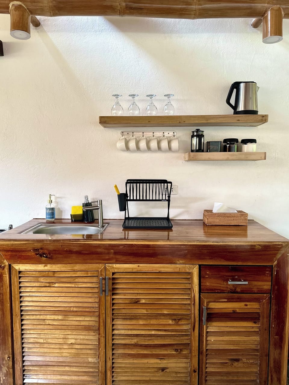 Villa | Private kitchen | Fridge, electric kettle, cookware/dishes/utensils, dining table