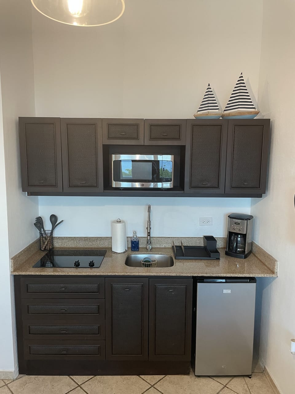 Kitchen w/ microwave/fridge/cooktop/dishes/pots & pans/coffee maker/toaster etc.