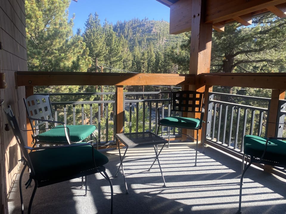 Private covered corner deck facing East (for morning sun).