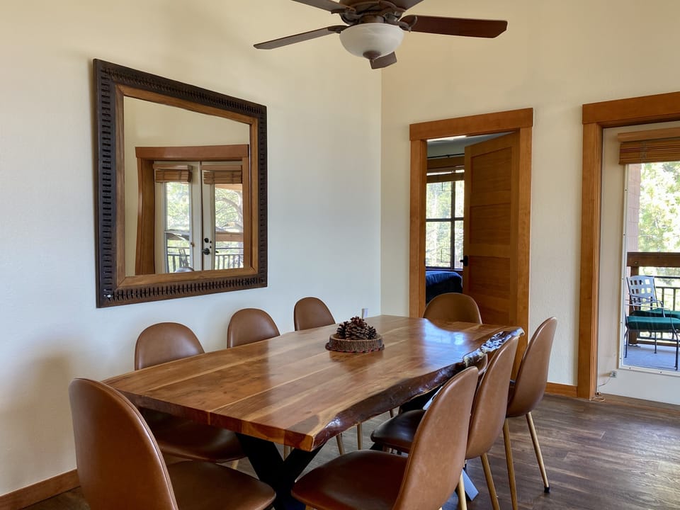 Dining area seats 8 comfortably in open floor plan