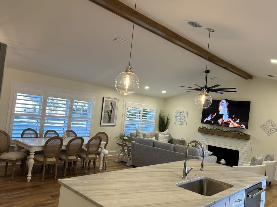 Kitchen Island & Dining Table Have View of the 75” TV!