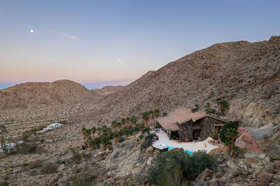 49 Palms Park Place on a mountainside overlooking city and National Park