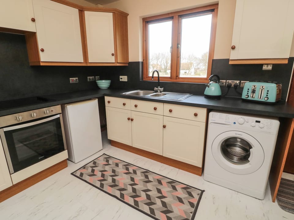 Fridge, electric kettle, toaster, cookware/dishes/utensils