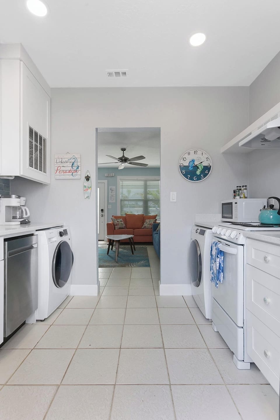 Fully equipped kitchen with apartment-size appliances.  Kitchen sink, dishwasher, coffee maker, Keurig coffee maker, dishwasher, clothes washer, dryer, 4 burner range/oven, and refrigerator.  The back door to the kitchen leads out to your private fen