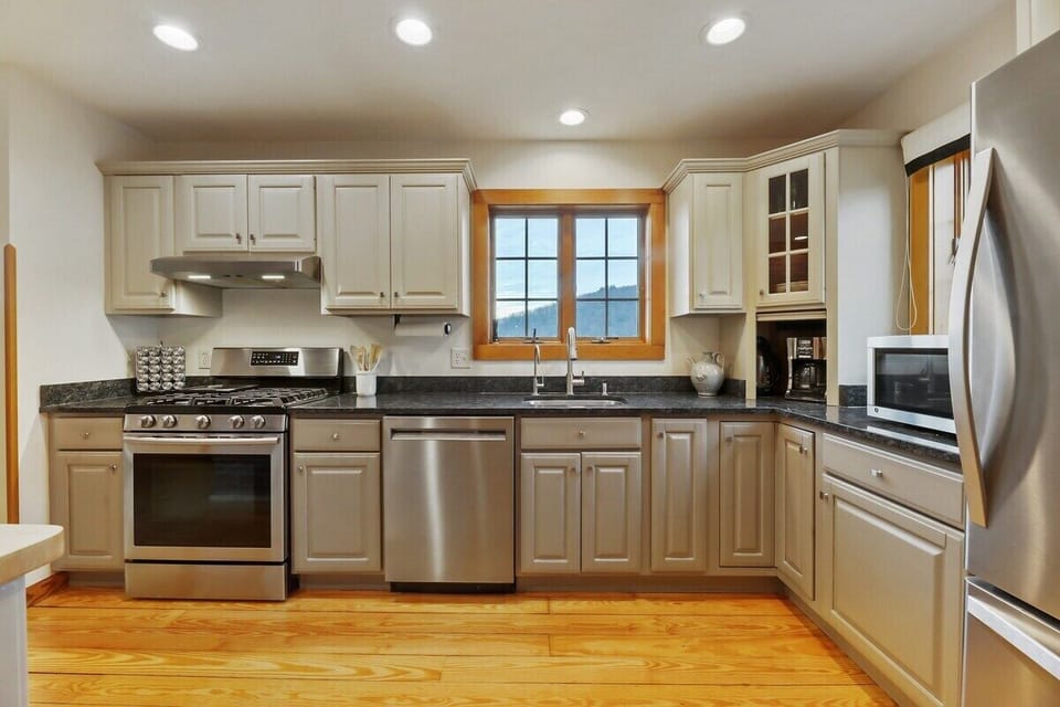 House 1 Kitchen with stainless appliances and mountain views