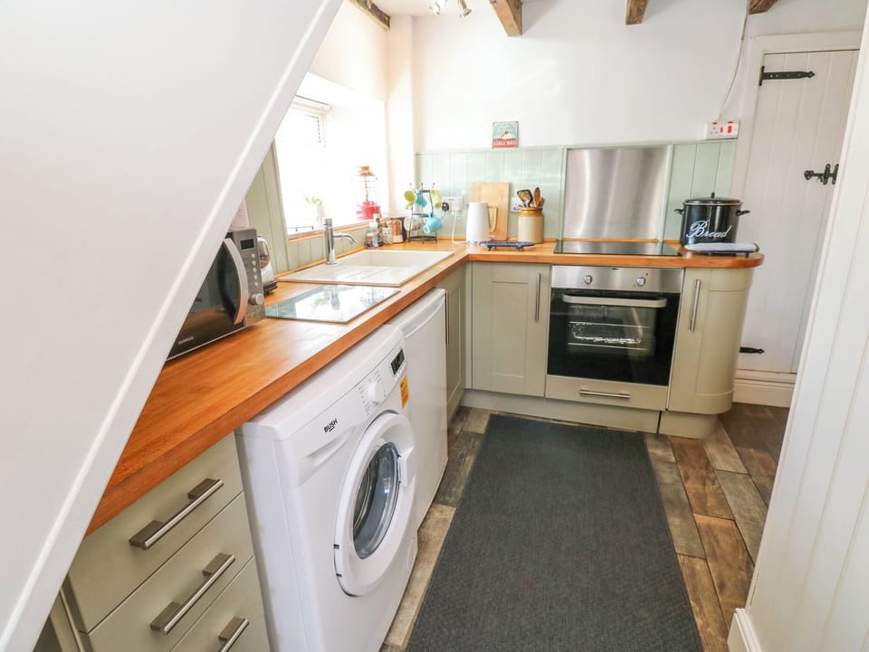 Fridge, electric kettle, toaster, cookware/dishes/utensils