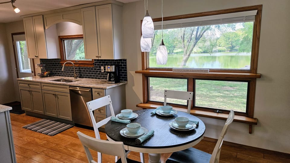 Open concept dining with lake views through the large picture window