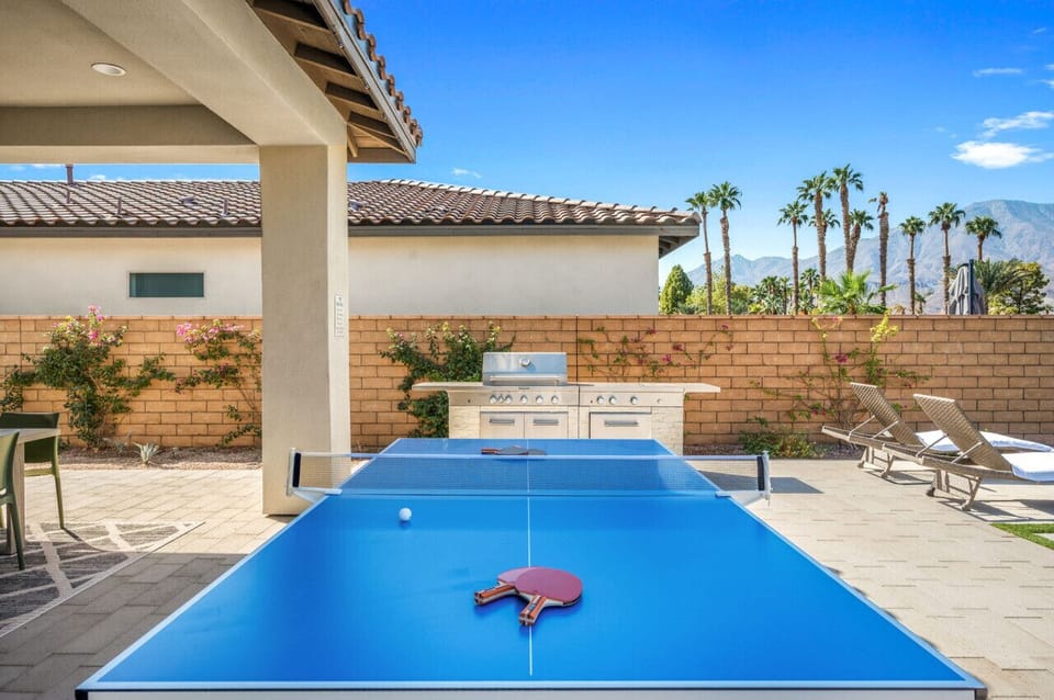 Poolside ping pong table ready for fun-filled afternoons in the sun
