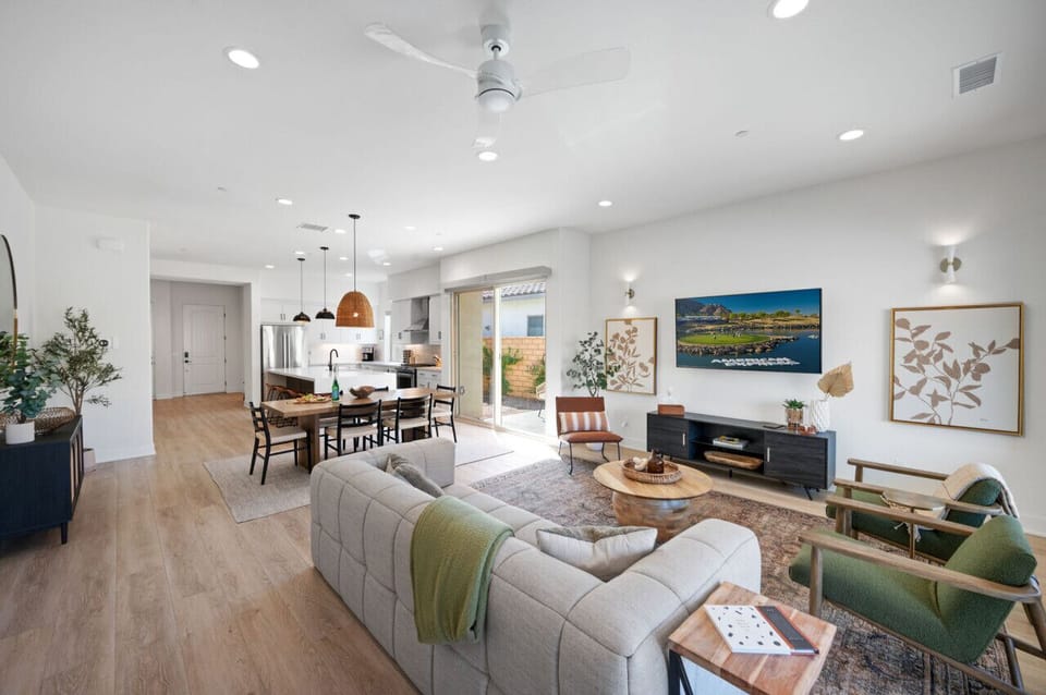 Open-concept living space w/ stylish decor, comfy seating & bright natural light