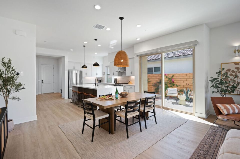 Open dining area flowing into the kitchen, ideal for shared meals & easy entertaining
