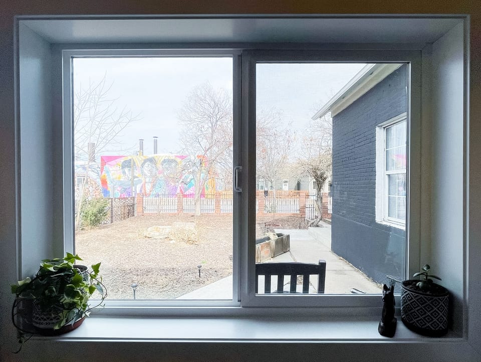 Downstairs bedroom window looking out onto Larimer St.