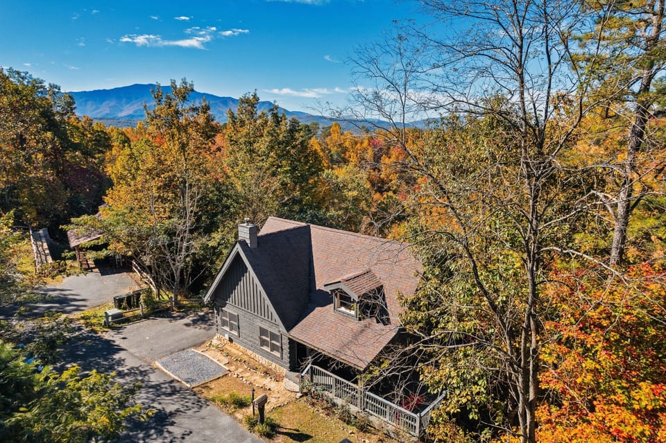 The cabin awaits, at the top of the ridge, surrounded by nature.