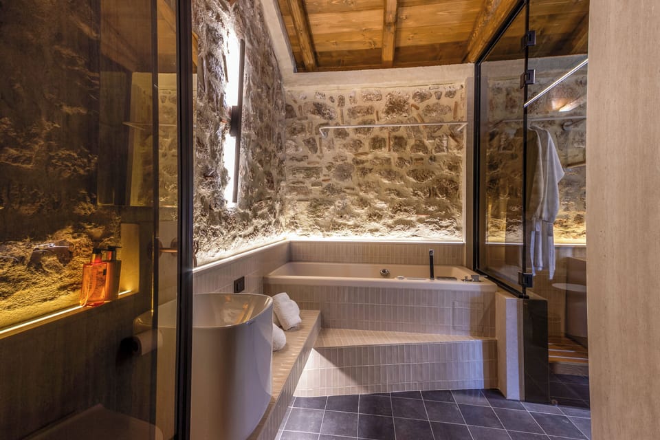 Luxury Studio Suite | Bathroom | Designer toiletries, hair dryer, bathrobes, slippers
