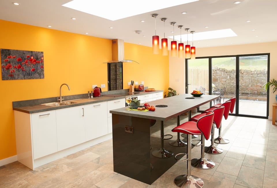 Evenwood Granary, Shropshire: Fully equipped kitchen with patio door to rear patio