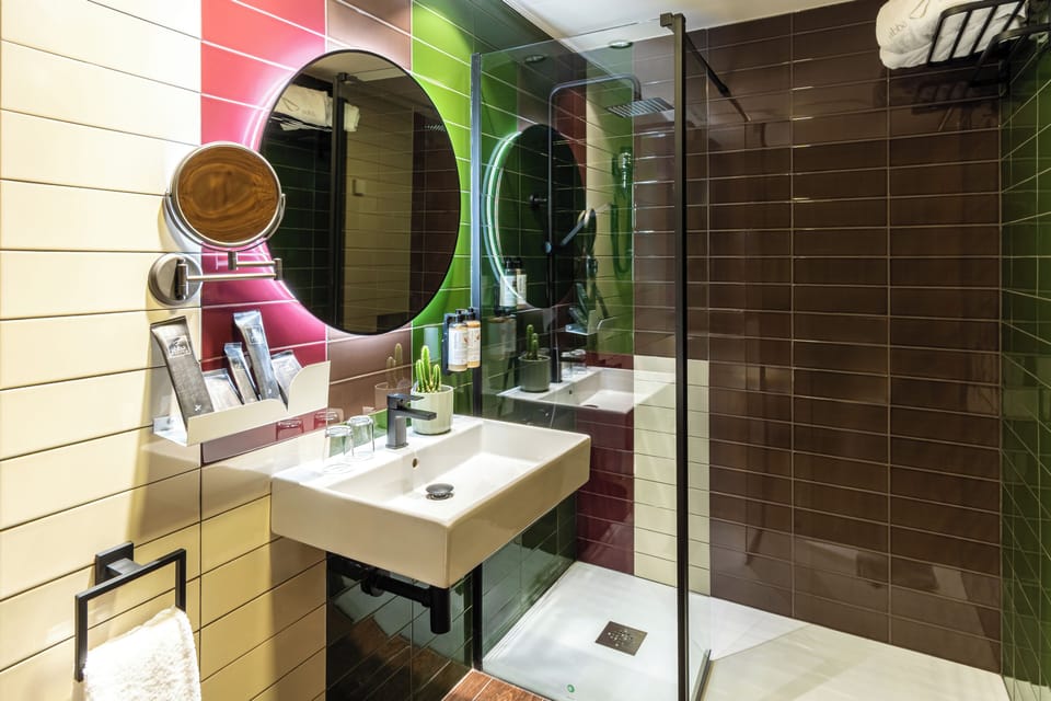 Shower, eco-friendly toiletries, hair dryer, towels
